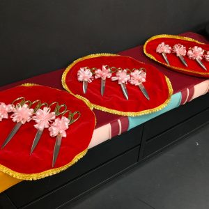 Golden scissors with ribbons